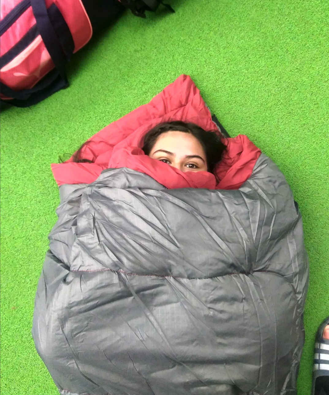 Staying cozy in a sleeping bag at orientation